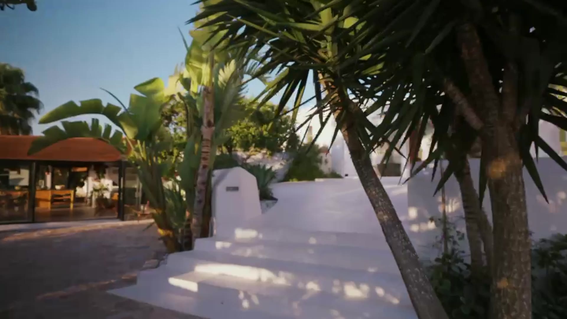 Whitewashed entrance path at Can Aylma