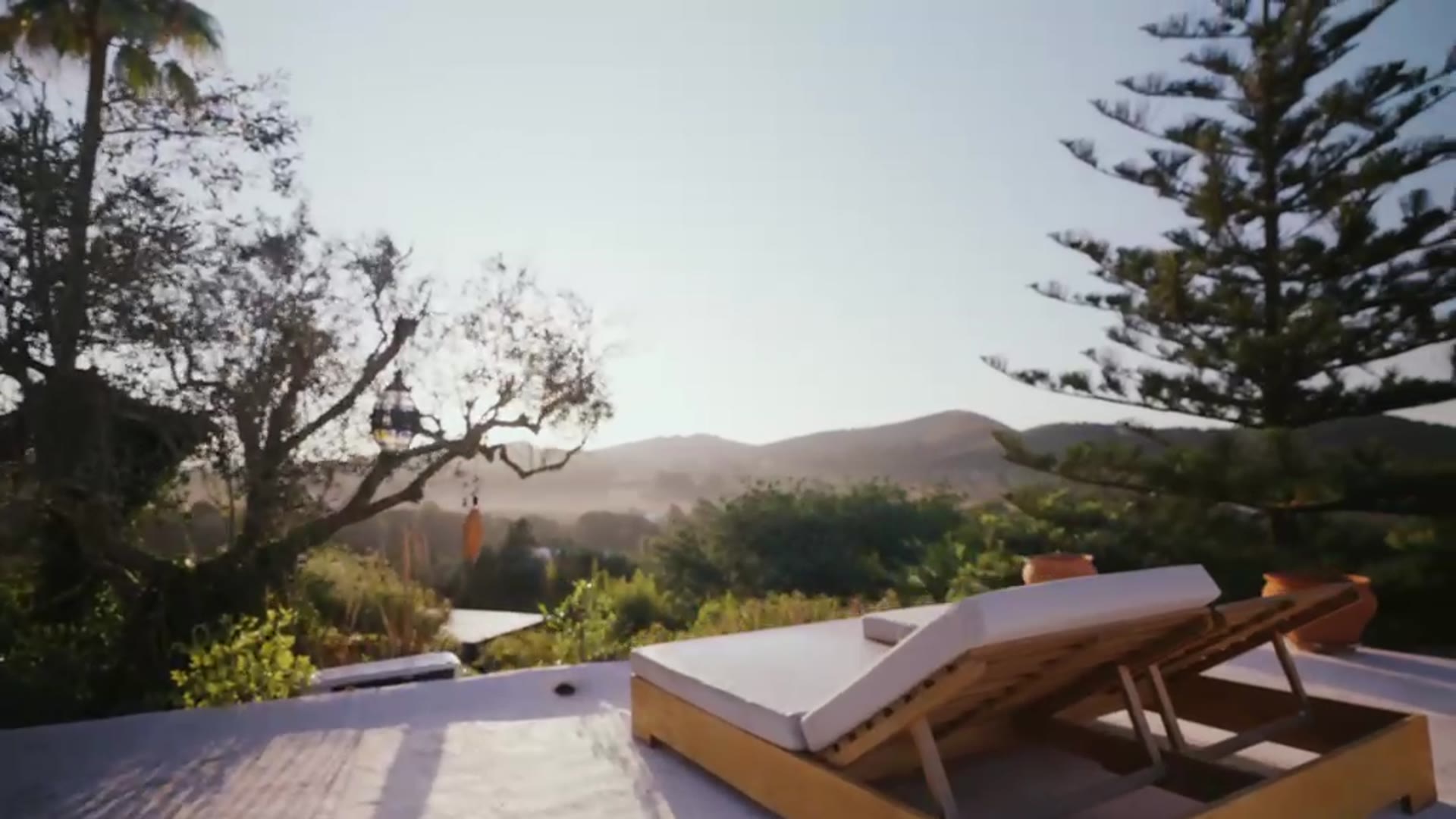 Lounge chairs overlooking the Ibiza hills